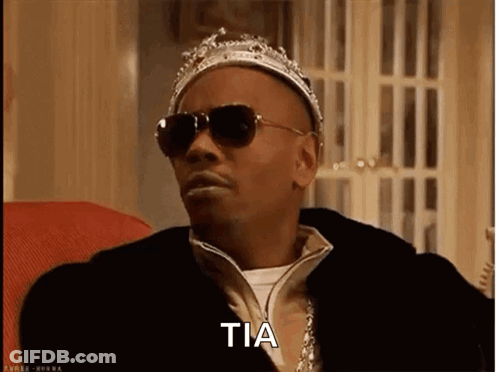 Elderly Woman In Fur Coat Holding Pink Gun Says Hi My Name Is Rizz And Im Rich GIF