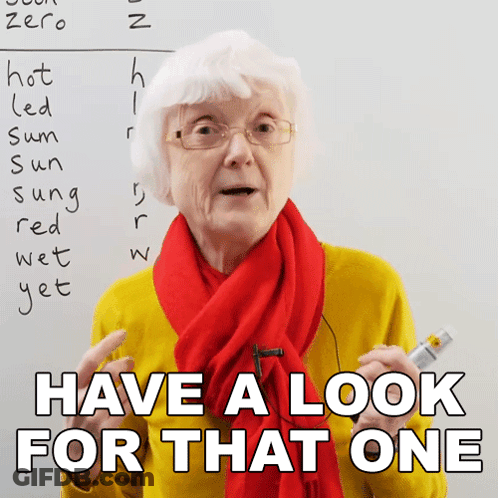 Elderly Woman In Glasses And Red Scarf Saying Have A Look For That One GIF