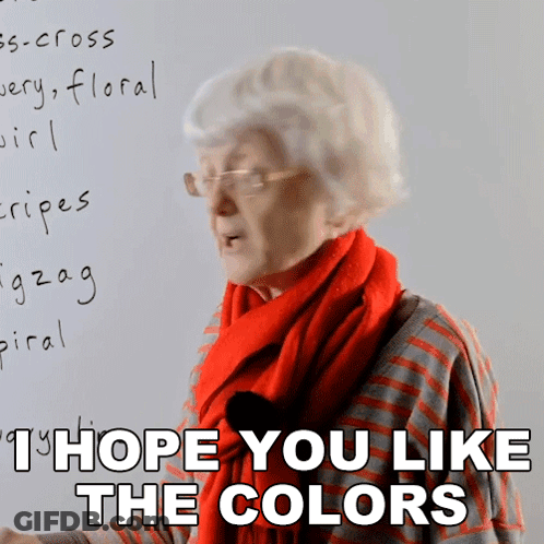 Elderly Woman In Glasses And Red Scarf Says I Hope You Like The Colors GIF