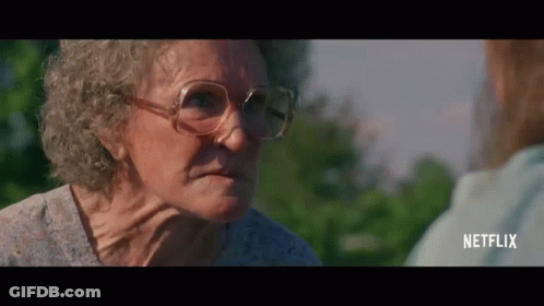 Elderly Woman In Glasses Talking To Another Woman GIF