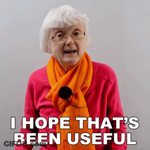 Elderly Woman In Orange Scarf And Pink Sweater Says I Hope That's Been Useful GIF