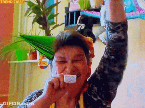 Elderly Woman In Party Hat Eating Cake GIF