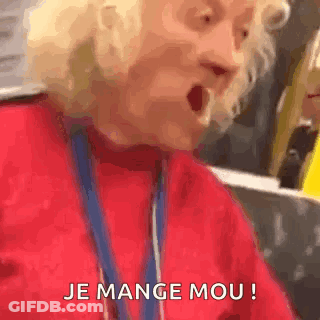 Elderly Woman In Red Sweater Making Funny Face GIF