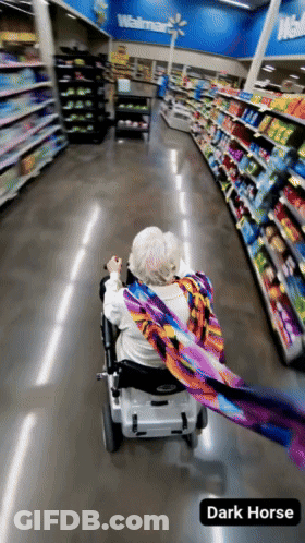 Elderly Woman In Wheelchair Walking GIF