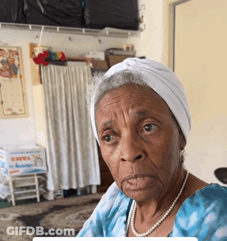 Elderly Woman In White Turban And Pearls Saying Yams GIF