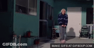 Elderly Woman Jumping In Front Of Blue Building Make GIFs At Gifsoup GIF