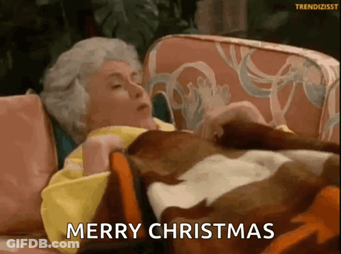 Elderly Woman Laying On Couch With Blanket Merry Christmas GIF