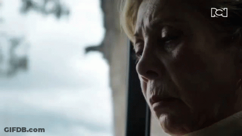 Elderly Woman Looking Out Window Eyes Closed GIF