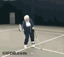 Elderly Woman Playing Tennis With Cane GIF