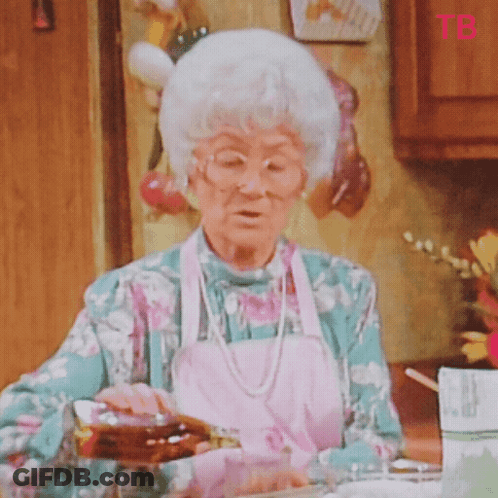 Elderly Woman Pouring Syrup Into Glass While Wearing Apron GIF