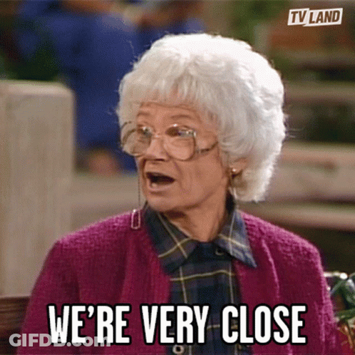 Elderly Woman Purple Sweater Says We're Very Close GIF