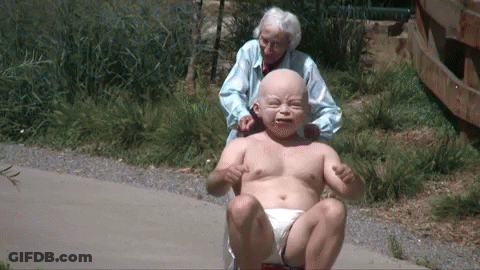 Elderly Woman Pushes Baby In Diaper GIF