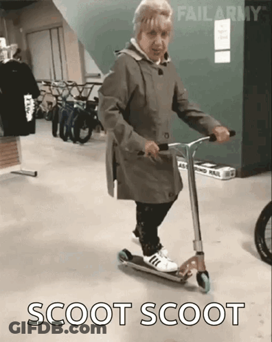 Elderly Woman Riding Scooter GIF