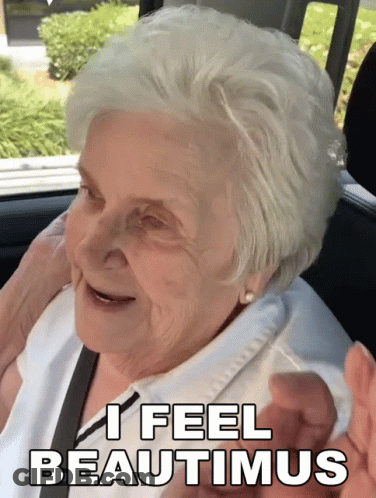 Elderly Woman Sitting In Car With I Feel Beautiful GIF
