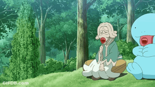 Elderly Woman Sitting In Grass With Lollipop GIF
