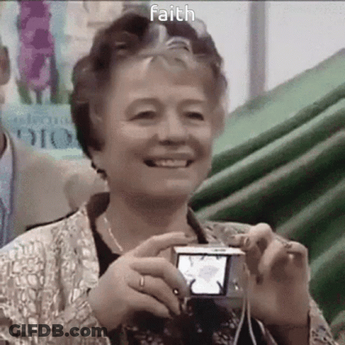 Elderly Woman Smiling Holding Camera With Faith GIF