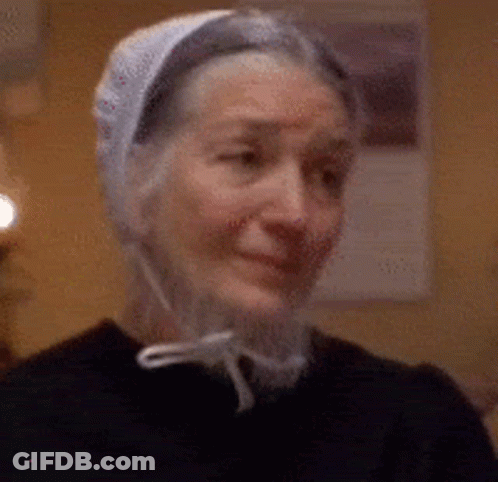 Elderly Woman Smiling In White Hat And Black Shirt GIF