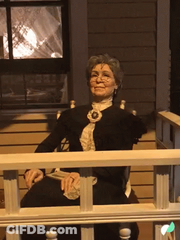 Elderly Woman Smiling On Porch GIF
