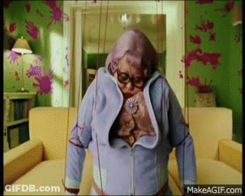 Elderly Woman Standing With Puppet GIF