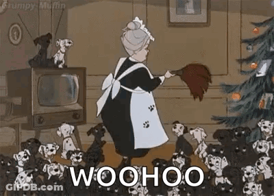 Elderly Woman Sweeping Floor By Christmas Tree With Dalmatian Puppies GIF