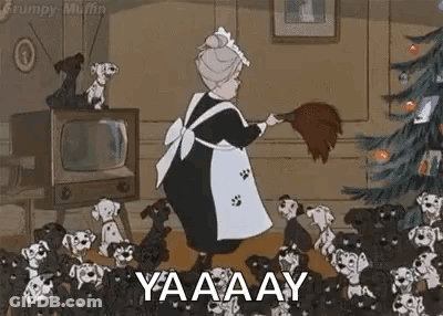 Elderly Woman Sweeping Floor In Front Of Christmas Tree GIF