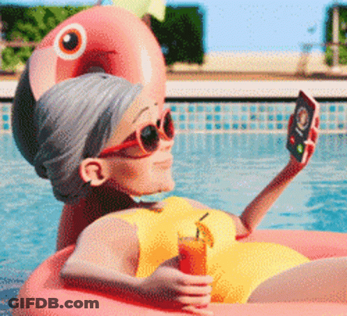 Elderly Woman Taking Selfie In Pool On Flamingo Float GIF