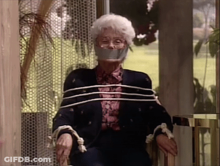 Elderly Woman Tied Up With Ropes And Tape In Chair GIF