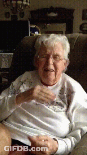 Elderly Woman Wearing Glasses And White Sweater GIF