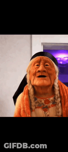 Elderly Woman Wearing Native American Mask GIF
