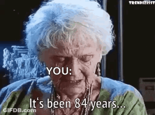 Elderly Woman With Blue Hair Talking About Age GIF