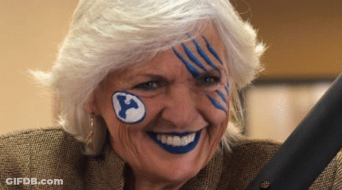 Elderly Woman With Blue Paint And Y On Forehead GIF
