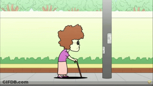 Elderly Woman With Cane Next To Pole GIF