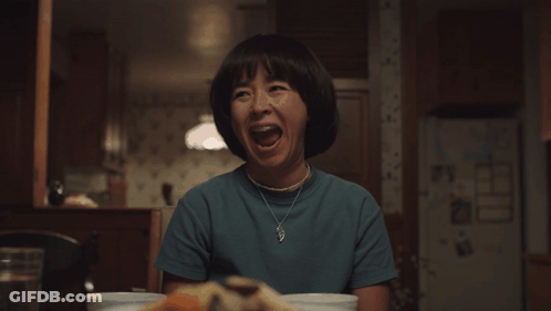 Elderly Woman With Glasses Eating Rice With Chopsticks GIF