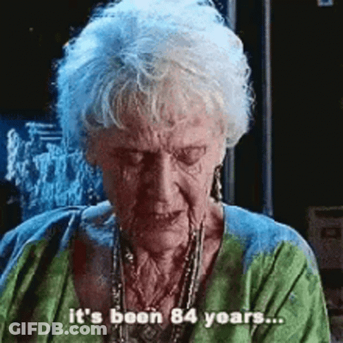 Elderly Woman With Gray Hair Says It's Been 84 Years GIF