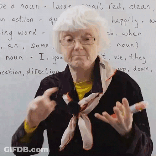 Elderly Woman With White Board Saying Be A Noun Large GIF