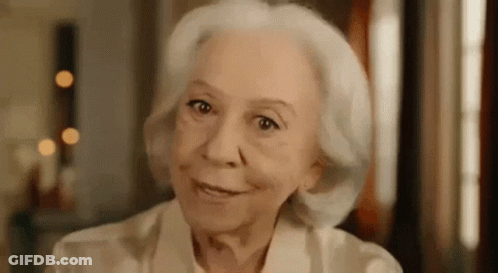 Elderly Woman With White Hair Smiling At Camera GIF