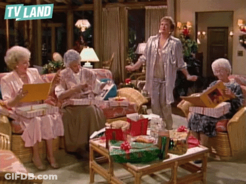 Elderly Women Sitting In Living Room With TV Land Logo GIF