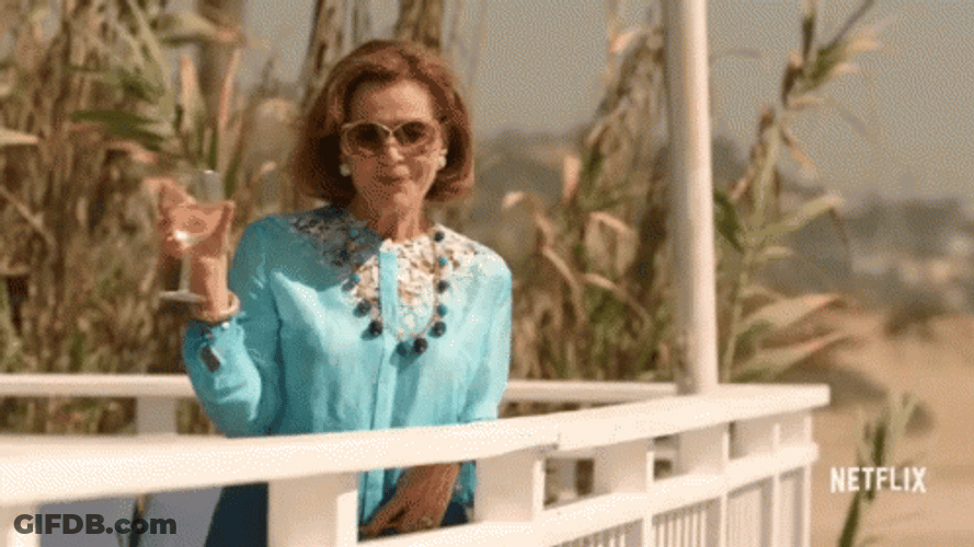 Elegant Lucille Bluth Holding Wine Glass GIF