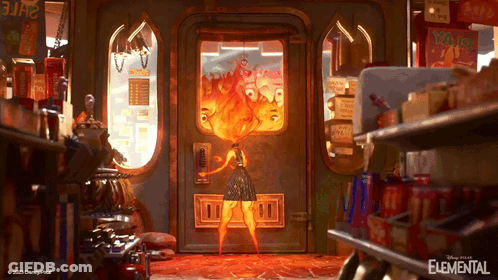Elemental Poster Woman In Front Of Door With Fire GIF