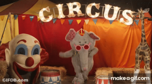 Elephant And Clown Dancing By Circus Sign GIF