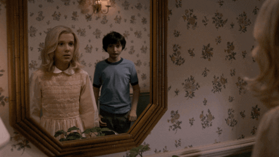 Eleven Looking At Her Own Reflection GIF