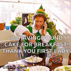 Elf Man Talking On Cell Phone At Table GIF