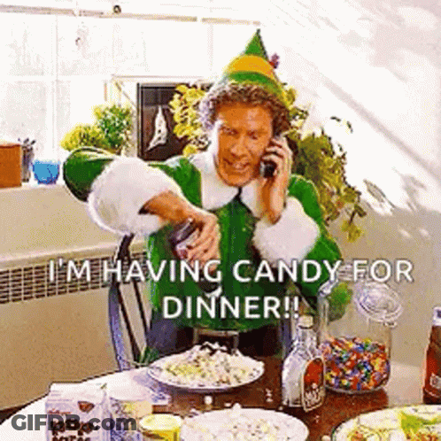 Elf Man Talking On Cell Phone At Table GIF