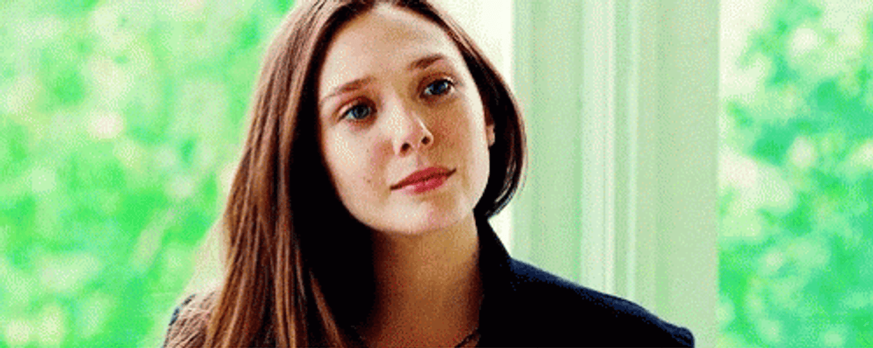 Elizabeth Olsen Shy Smirking GIF