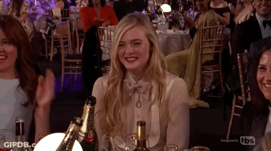 Elle Fanning Flattered Headshake SAG Awards GIF