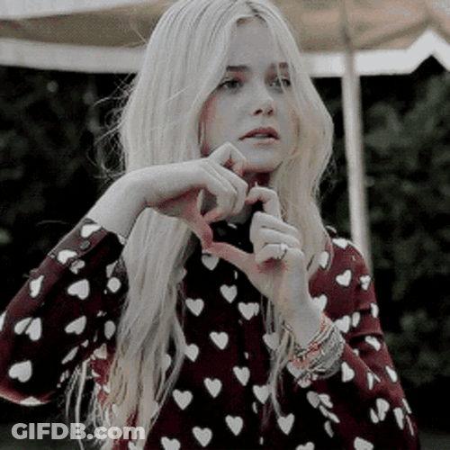 Elle Fanning Heartbreak Hand Sign Laugh GIF