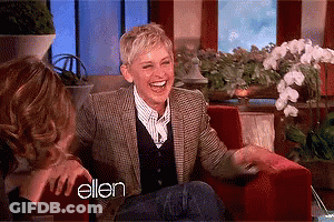 Ellen Degeneres Is Laughing While Sitting In A Chair GIF