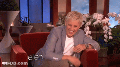 Ellen Degeneres Is Laughing While Sitting In A Chair On A Television Show . GIF