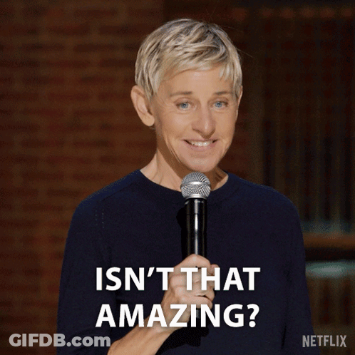 Ellen Degeneres Is Smiling While Holding A Microphone And Says " Isn T That Amazing " GIF