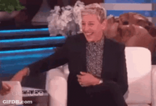 Ellen Degeneres Is Smiling While Sitting In A Chair On The Ellen Degeneres Show GIF